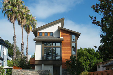 Mid-sized trendy three-story mixed siding exterior home photo in San Francisco with a shed roof