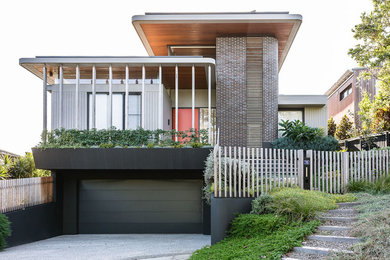 Modelo de fachada de casa multicolor contemporánea con tejado plano