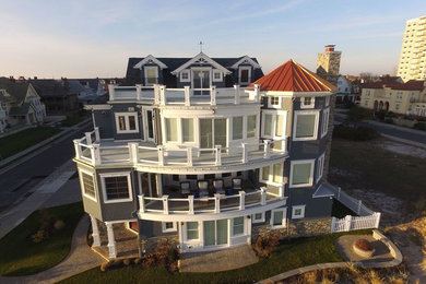 Huge coastal gray three-story mixed siding exterior home idea in Philadelphia