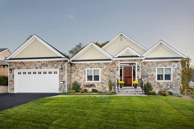 Inspiration for a small transitional beige one-story stone gable roof remodel in Boston