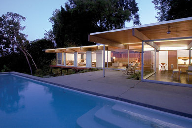 Inspiration for a modern one-story glass flat roof remodel in Los Angeles