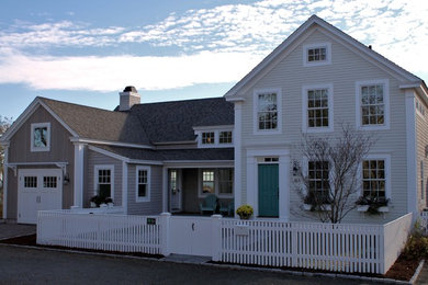 Example of a classic beige two-story mixed siding exterior home design in Providence