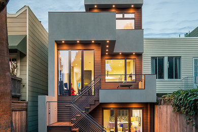 Mid-sized contemporary gray three-story stucco flat roof idea in San Francisco