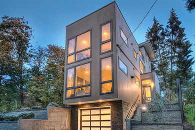 Ejemplo de fachada de casa beige contemporánea de tamaño medio de tres plantas con revestimiento de aglomerado de cemento y tejado plano