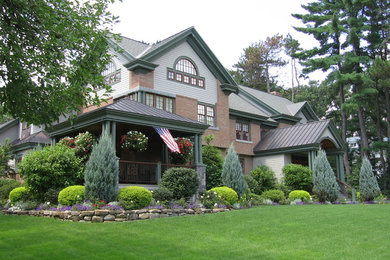 Example of a classic three-story mixed siding exterior home design in Boston