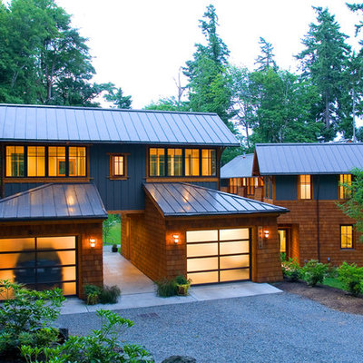 Inspiration for a contemporary wood exterior home remodel in Seattle with a metal roof