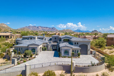 Example of a huge tuscan two-story house exterior design in Phoenix