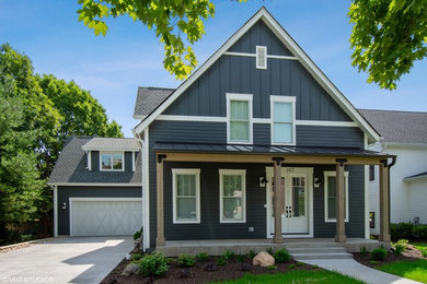 Mid-sized farmhouse gray two-story wood exterior home photo in Chicago with a shingle roof