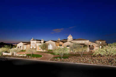 Inspiration for a mediterranean house exterior in Phoenix.