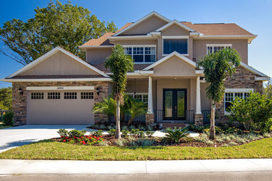 Design ideas for a beige traditional two floor detached house in Tampa.