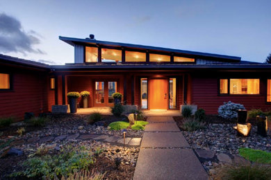 Inspiration for a mid-sized modern red one-story concrete fiberboard exterior home remodel in Portland