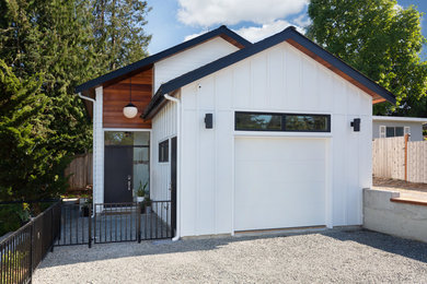 Inspiration for a small contemporary white two-story wood exterior home remodel in Seattle