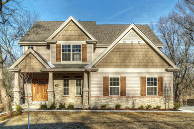 Example of an arts and crafts exterior home design in St Louis