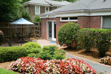 Example of a small transitional red one-story brick exterior home design in Atlanta