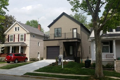 Example of a small transitional brown two-story concrete fiberboard exterior home design in Cincinnati with a shingle roof