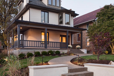 Example of a mid-sized transitional gray three-story brick exterior home design in Cincinnati