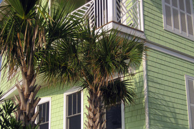 Coastal green three-story mixed siding exterior home idea in Jacksonville