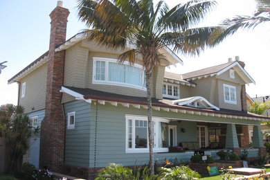 Inspiration for a large coastal beige two-story mixed siding exterior home remodel in San Diego