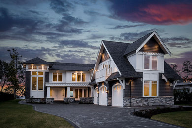Huge elegant gray two-story mixed siding house exterior photo in Vancouver with a hip roof and a shingle roof
