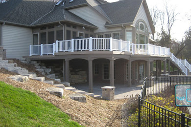 Example of a large classic brown two-story wood gable roof design in Milwaukee