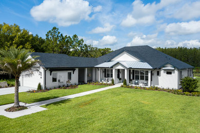 Example of a country exterior home design in Tampa