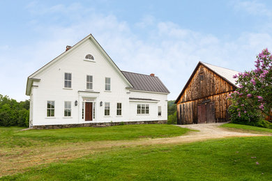 Example of a mid-sized country exterior home design