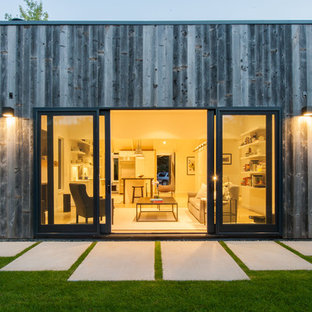 Trendy one-story wood exterior home photo in Denver