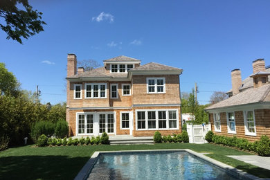 Expansive and brown traditional detached house in New York with three floors, wood cladding, a pitched roof and a shingle roof.