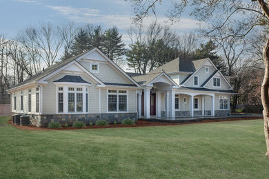 Mid-sized elegant multicolored two-story mixed siding exterior home photo in New York with a shingle roof