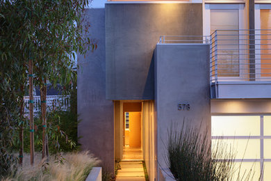 Trendy concrete exterior home photo in Los Angeles