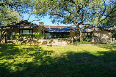 Example of a mid-sized trendy one-story wood house exterior design in Austin