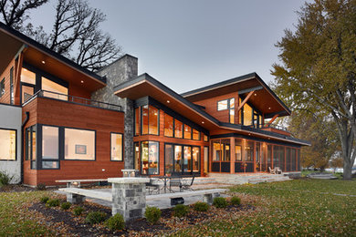 Inspiration for a large modern two-story house exterior remodel in Other