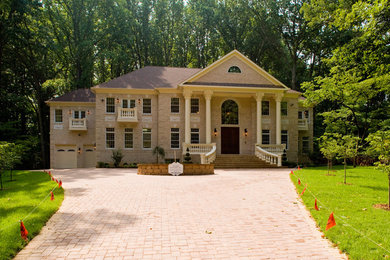 Mid-sized transitional beige two-story brick exterior home photo in DC Metro with a shingle roof