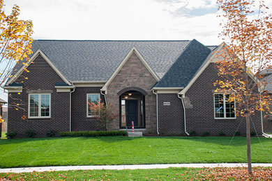 Example of a brown two-story exterior home design in Toronto