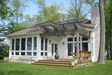 Small white one-story wood exterior home idea in Other