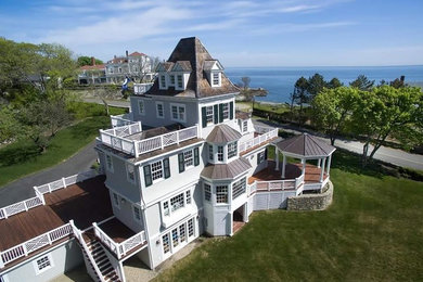 Huge victorian white three-story wood exterior home idea in Boston