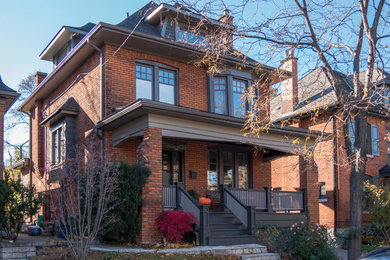 Large traditional three-story brick house exterior idea in Toronto with a hip roof and a shingle roof