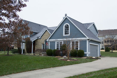 Example of a mid-sized classic blue two-story mixed siding exterior home design in Cincinnati