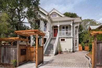 Example of a transitional gray split-level exterior home design in San Francisco