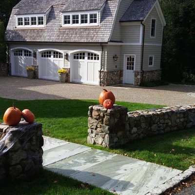 Inspiration for a large timeless gray two-story vinyl gable roof remodel in New York