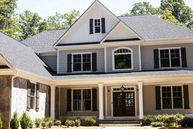 Example of a large gray three-story brick exterior home design in Atlanta