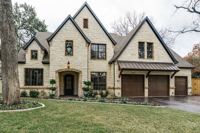 Large and white traditional two floor house exterior in Dallas with stone cladding.