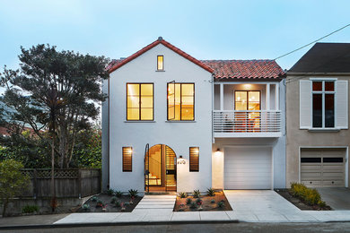 Example of a mid-sized minimalist gray three-story stucco exterior home design in San Francisco with a tile roof
