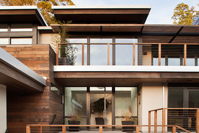 Inspiration for a huge contemporary brown two-story wood flat roof remodel in San Francisco
