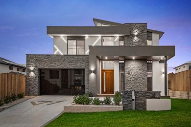 Großes, Zweistöckiges Modernes Einfamilienhaus mit weißer Fassadenfarbe und Blechdach in Brisbane