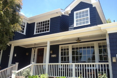 Photo of a large and blue traditional two floor house exterior in Los Angeles with wood cladding.
