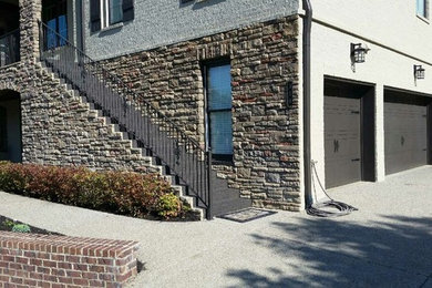 Transitional gray brick exterior home photo in Nashville