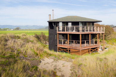 Mid-sized coastal black three-story wood house exterior idea in Other