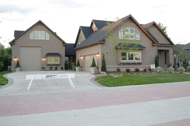 Medium sized and beige traditional two floor house exterior in Boise with mixed cladding and a pitched roof.
