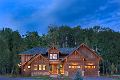 Inspiration for a mid-sized rustic brown two-story wood exterior home remodel in Other with a shingle roof